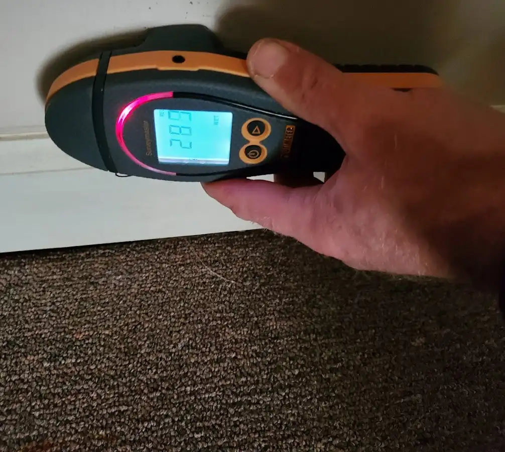 Moisture detection at baseboard during Storm Damage Restoration in Margate